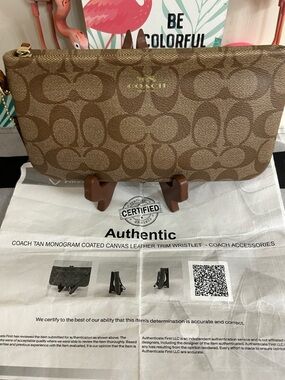 Coach Brown Signature Monogram Clutch with Leather Strap